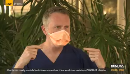 Dr Andrew Miller demonstrating N95 mask