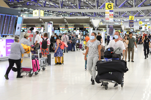 Passengers wearing masks at airport