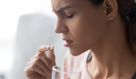 Woman taking paracetamol